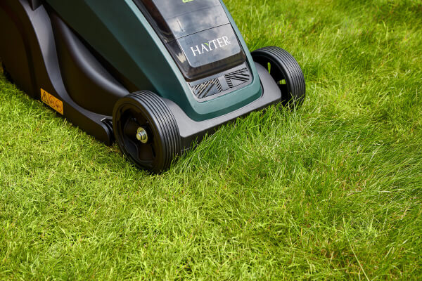 Close up shot of Hayter Lawnmower cutting grass