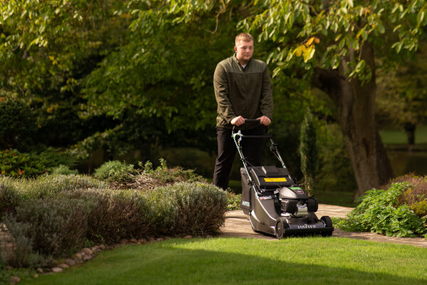 Man using Hayter Lawnmower