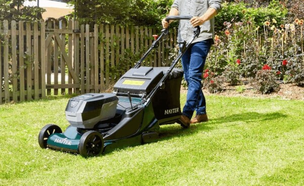 Battery lawnmower on a freshly cut lawn