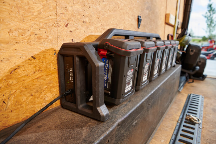 Close-up of 60V Flex-Force 6-Pod Charger mounted in a professional work van charging multiple batteries